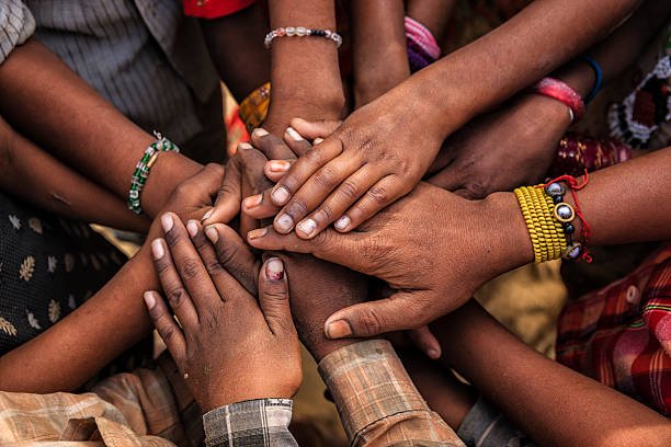 Children's hands in one of Indian villages showing unity.