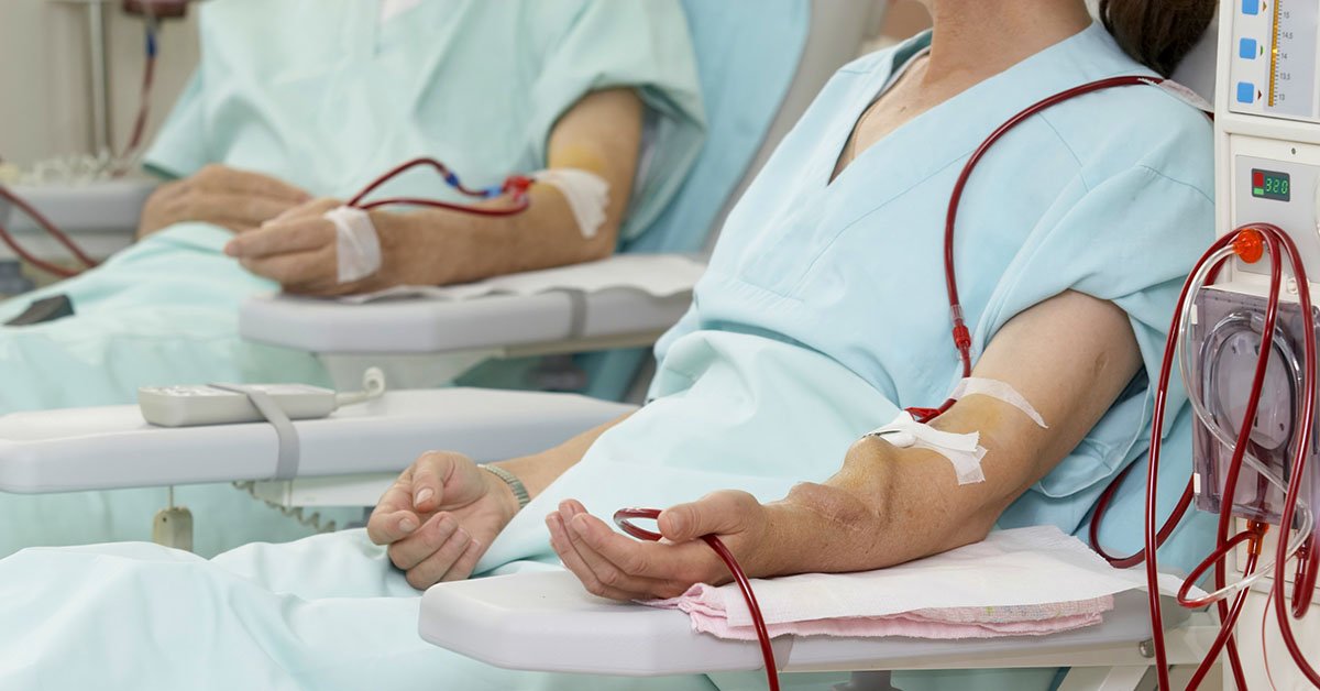 patient monitored by electronic sphygmomanometer during dialysis session